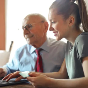 old man and young women with laptop